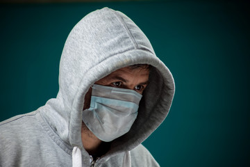 A portrait of man with medical face mask. People, medicine, healthcare concept. Coronavirus protection