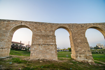 Fototapeta na wymiar Old Kamares aqueduct in city Larnaca, Cyprus.