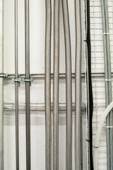 Industrial wall mounted vertical running stainless aluminum pipes
