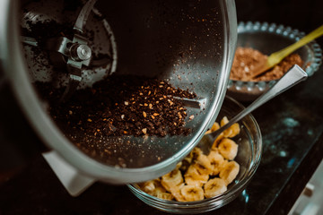 Process of mixing healthy and natural ingredients to cook at home some oatmeal, chocolate and banana cookies without refined sugar. Real food. Lifestyle