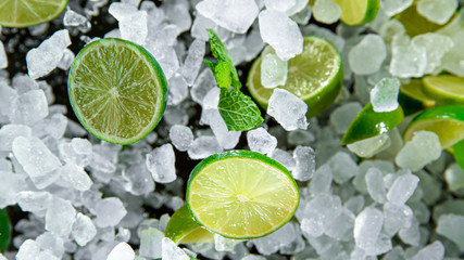 Freeze Motion of exploding crushed ice with limes and mint, close-up