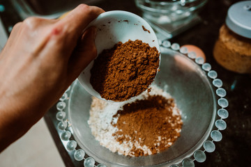 Process of mixing healthy and natural ingredients to cook at home some oatmeal, chocolate and banana cookies without refined sugar. Real food. Lifestyle