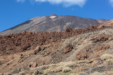 View of top of Teide mountain against the blue sky background, Tenerife, Canary Islands, Spain.