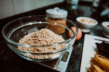 Selection of healthy and natural ingredients to prepare at home some oatmeal, chocolate and banana cookies without refined sugar. Real food. Lifestyle