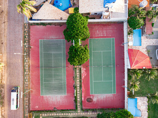 Aerial view of tennis field, red and green colored. 
