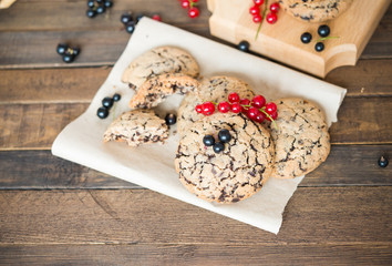 Sweet dessert. Homemade baking. Chocolate oatmeal cookies with black and red currants