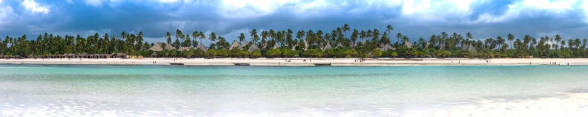 Foto auf Alu-Dibond panoramic view of the beach in zanzibar with palm trees and old fishing boats © Michael Barkmann