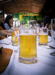 beer on white tablecloth with family