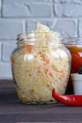 Fermented foods. Sauerkraut in a glass jar on a white background. Vegetarian food concept