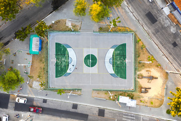 Aerial View of suburban Soccer Field with three guys playing.