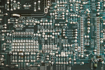 Contacts on a green chip with numbers and letters.