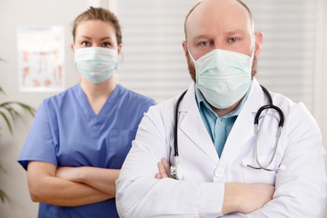 Portrait Of Confident Doctor And Nurse In Hospital