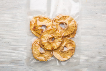 Pieces of dried pineapple packed in vacuum