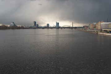 Fototapeta na wymiar view of the city of Riga Dvina river gray storm clouds