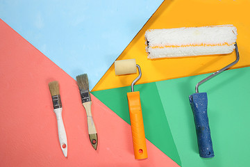 Repair tools on a multi-colored painted background. Shop banner, geometry. Minimal renovation and...