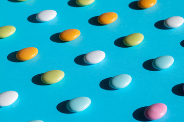 colorful candies on blue background