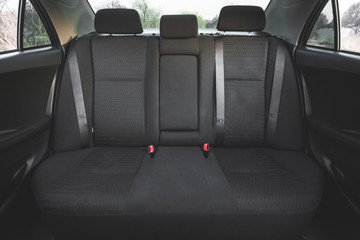 Car interior, part of back seats, close