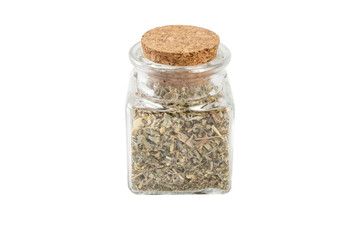 wormwood herb or in latin Absinthii herba herb in a glass jar isolated on white background. medicinal healing herbs. herbal medicine. alternative medicine