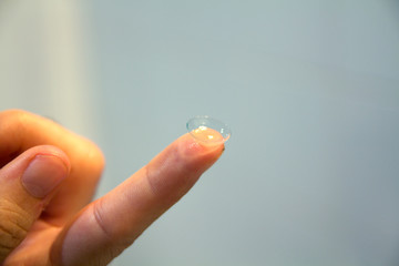 contact lens on a finger