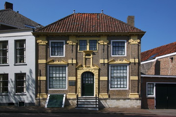 Baroque brick facade of Hoope House at the old harbor of Goes city in the Netherlands