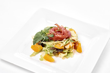 Big tasty food lies on white plate on isolate