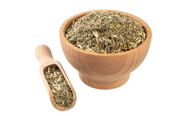 wormwood herb or in latin Absinthii herba herb in wooden bowl and scoop isolated on white background. medicinal healing herbs. herbal medicine. alternative medicine