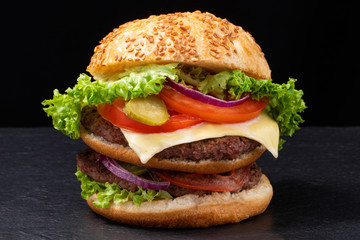 fresh tasty beef burger on dark background