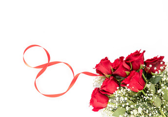 Happy Women's Day concept - beautiful bouquet of red roses and baby's breath white flowers isolated on a white background with copy space, top view.