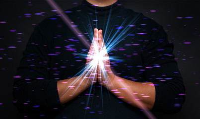 meditation hand with holy spiritual light, power of meditation, praying hand with bokeh light flare effect. 