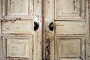 Vintage old wooden door with cracks background texture, peeling paint retro design