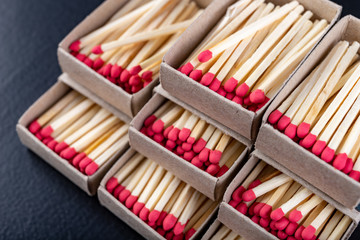 Matches in gray paper boxes. Wooden sticks with sulfur on the tip to ignite the flame.