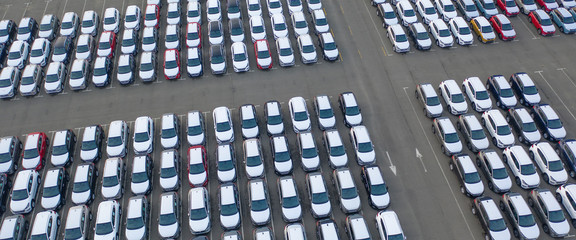 Naklejka premium Car Dealer Logistics Center, new cars parked. Drone view.