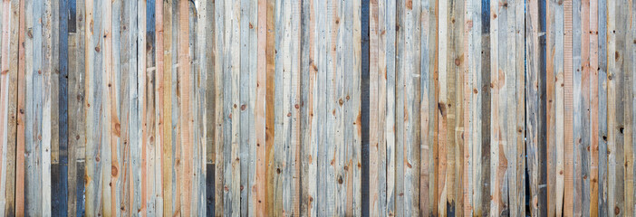 Brown wooden wall with vertical boards texture.