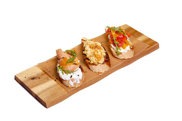 Toast with salmon on a wooden Board on a white background