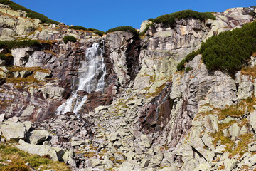 Mountain waterfall Skok, a tourist attraction near to Strbske Pleso in High Tatras National Park, Slovakia © andras_csontos