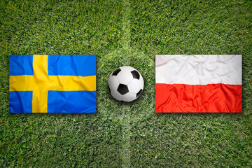 Sweden vs. Poland flags on soccer field