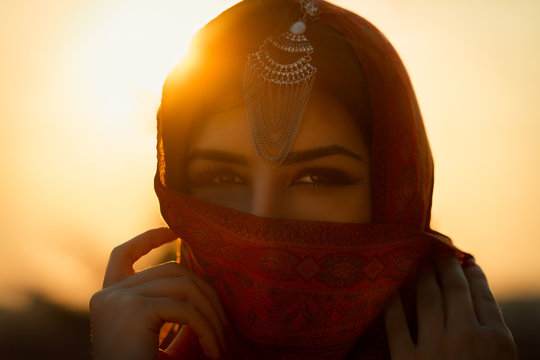 Close-up Portrait Of Woman Wearing Scarf And Maang Tikka