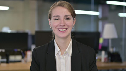 Portrait of Smiling Young Businesswoman Looking at Camera