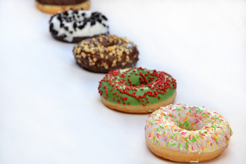 different donuts on a white background