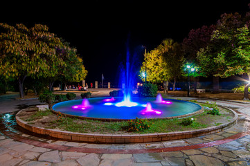 Kallithea, Greece - September 05,2019: Fountain in the center of Kallithea, Greece at night