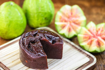 guava, sweet made from guava, homemade dessert, on rustic wooden background.