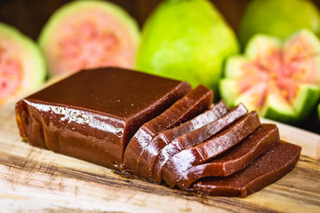guava, sweet made from guava, homemade dessert, on rustic wooden background.