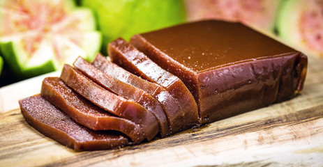guava, sweet made from guava, homemade dessert, on rustic wooden background.