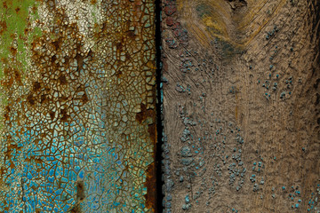 Peeling colored paint on old rusty metal. Abstract corrosion texture