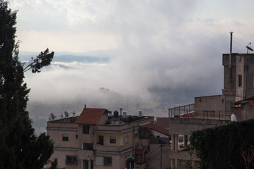 Fototapeta na wymiar Nazareth on a rainy morning with low clouds