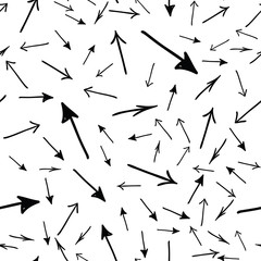Hand drawn straight tribal arrows randomly placed on white background. Seamless pattern. Right, left, up and down abstract pointers with arrowheads wrapping texture. Vector eps8 illustration.