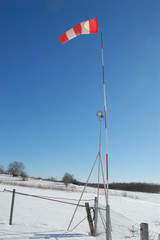 Wind indicator on sky background