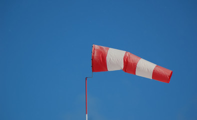 Wind indicator on sky background
