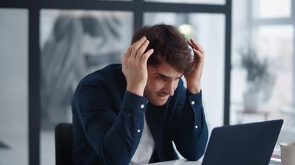 Upset businessman finding mistakes in documents. Frustrated man looking graphs - Powered by Adobe