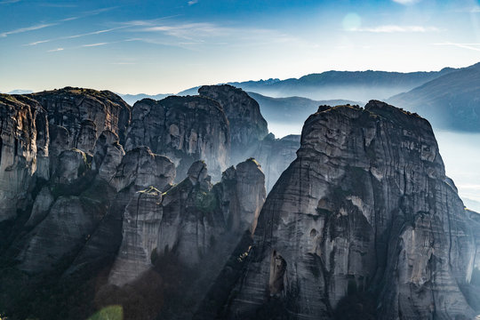 Aerial view of Unesco monument Meteora, the mountains, the landmark of Greek, sunny weather, fog, haze over a valley © Vladimir Drozdin
